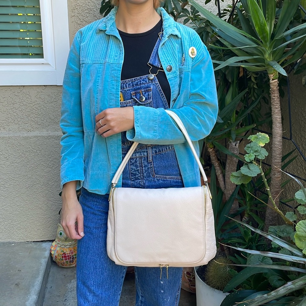 Light pink G.I.L.I pebbled leather shoulder bag